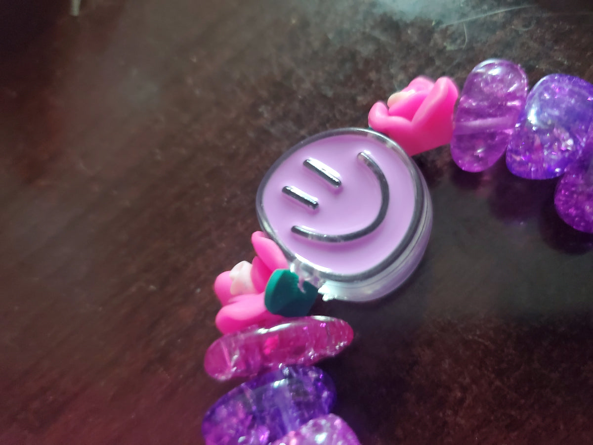 Funky purple beaded bracelet w/ toggle closure.