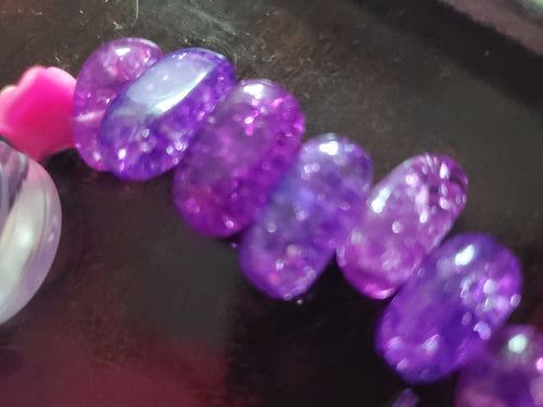 Funky purple beaded bracelet w/ toggle closure.