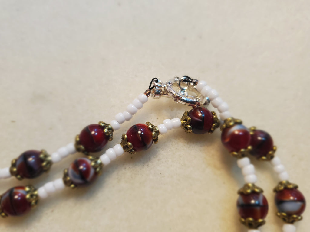 Dark red and white beaded necklace and bracelet set