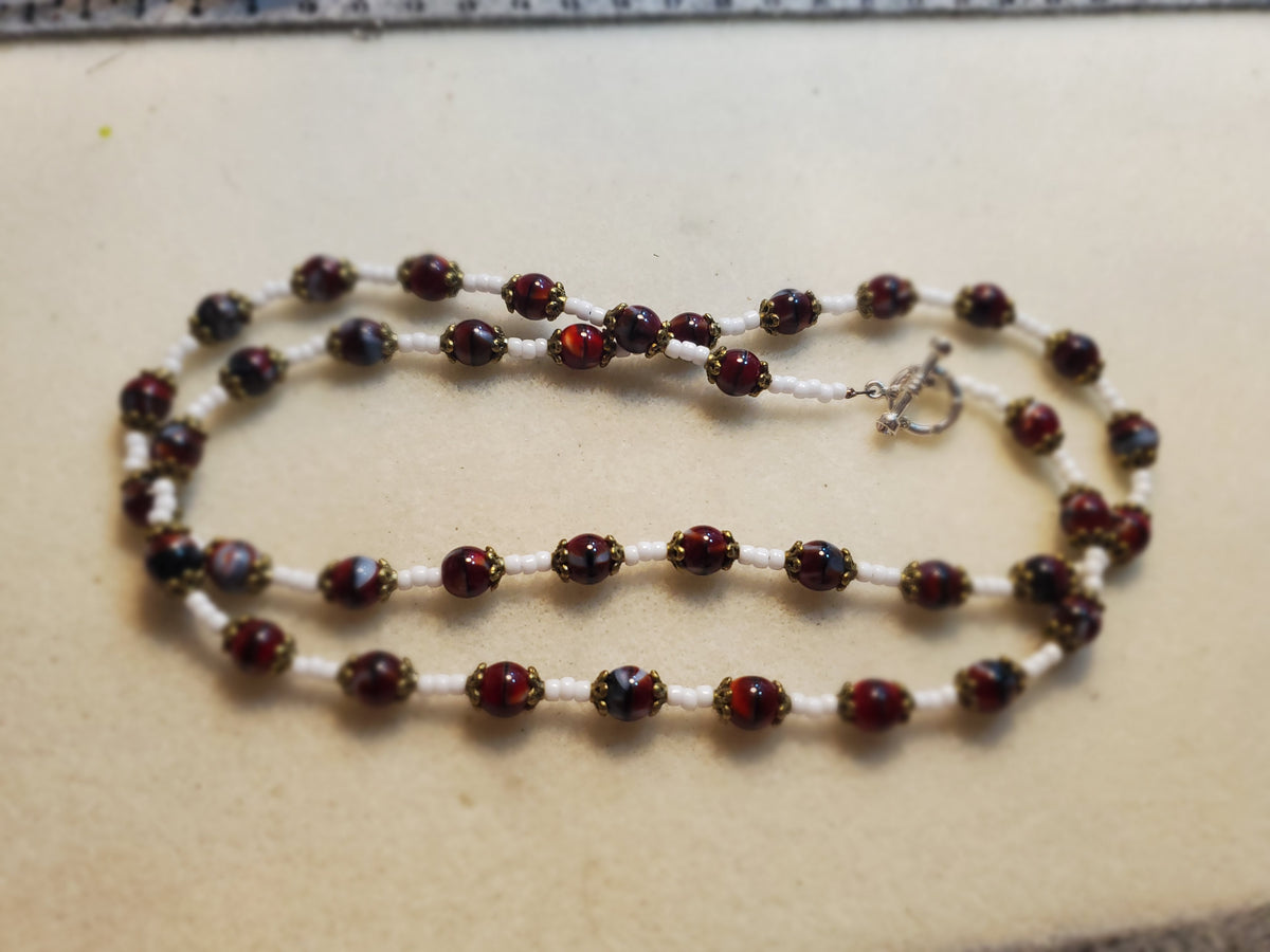 Dark red and white beaded necklace and bracelet set