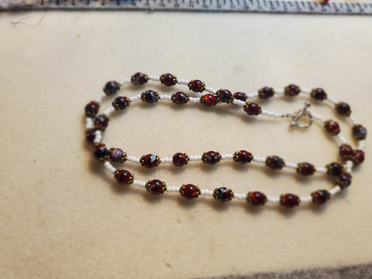 Dark red and white beaded necklace and bracelet set