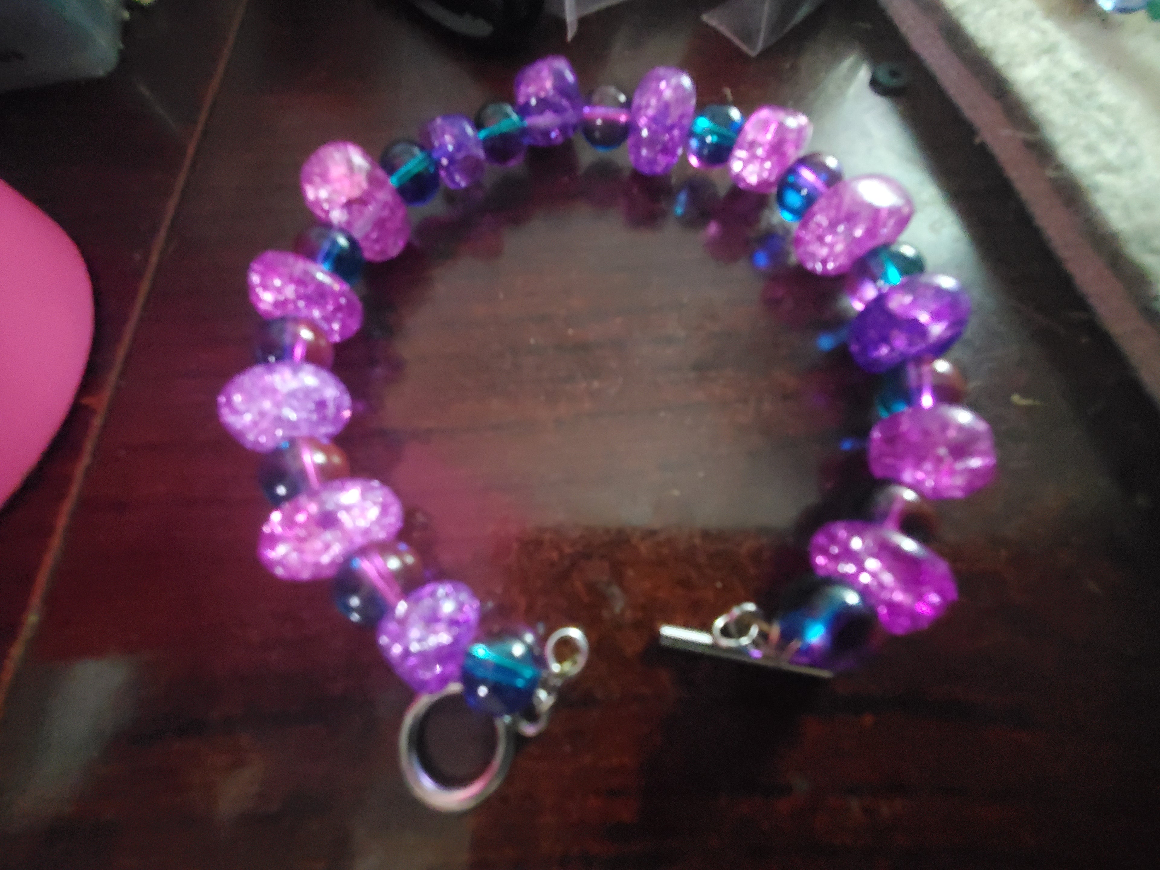 Funky purple beaded bracelet w/ toggle closure.